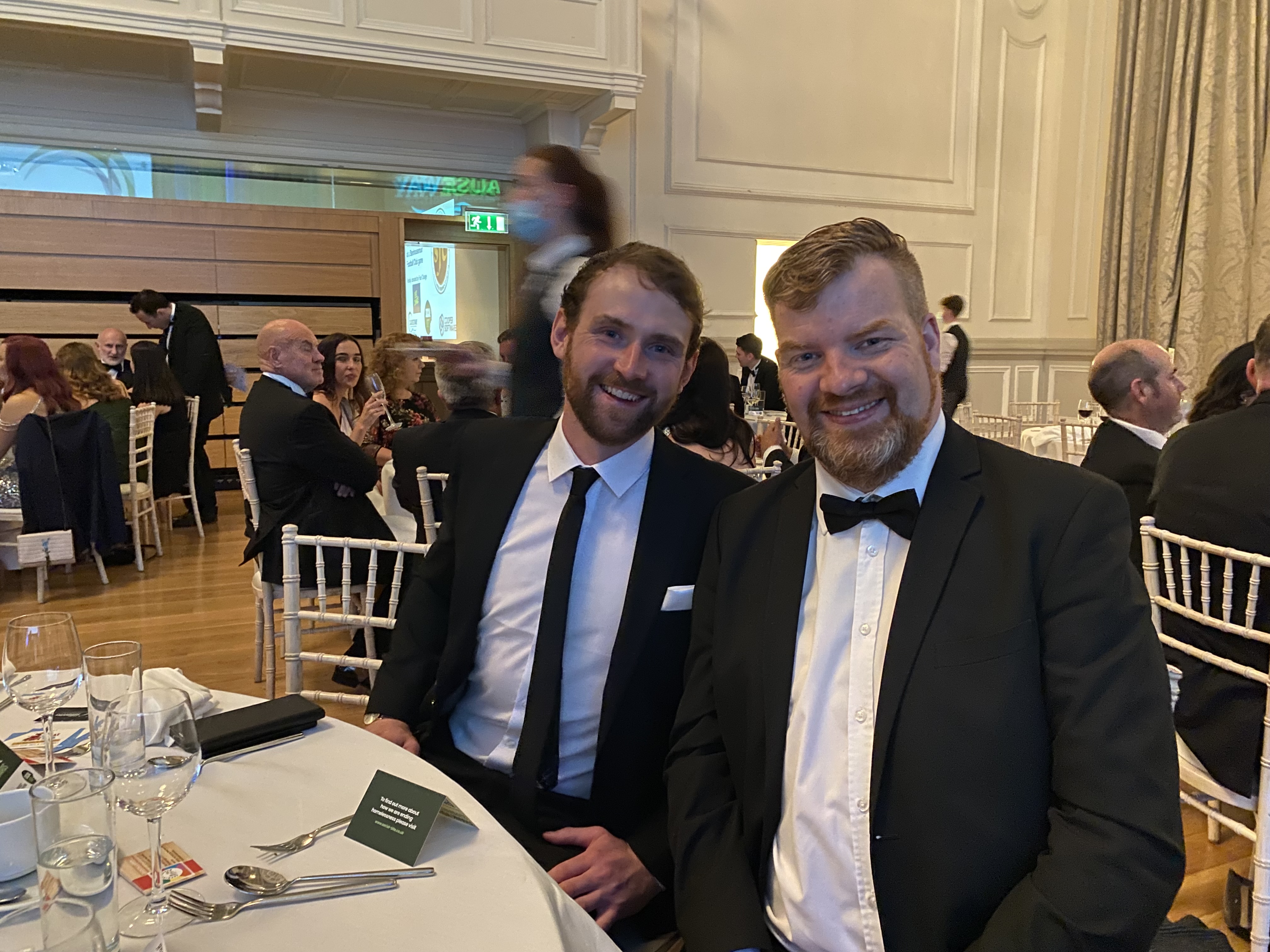 Two men in formal attire at a formal event