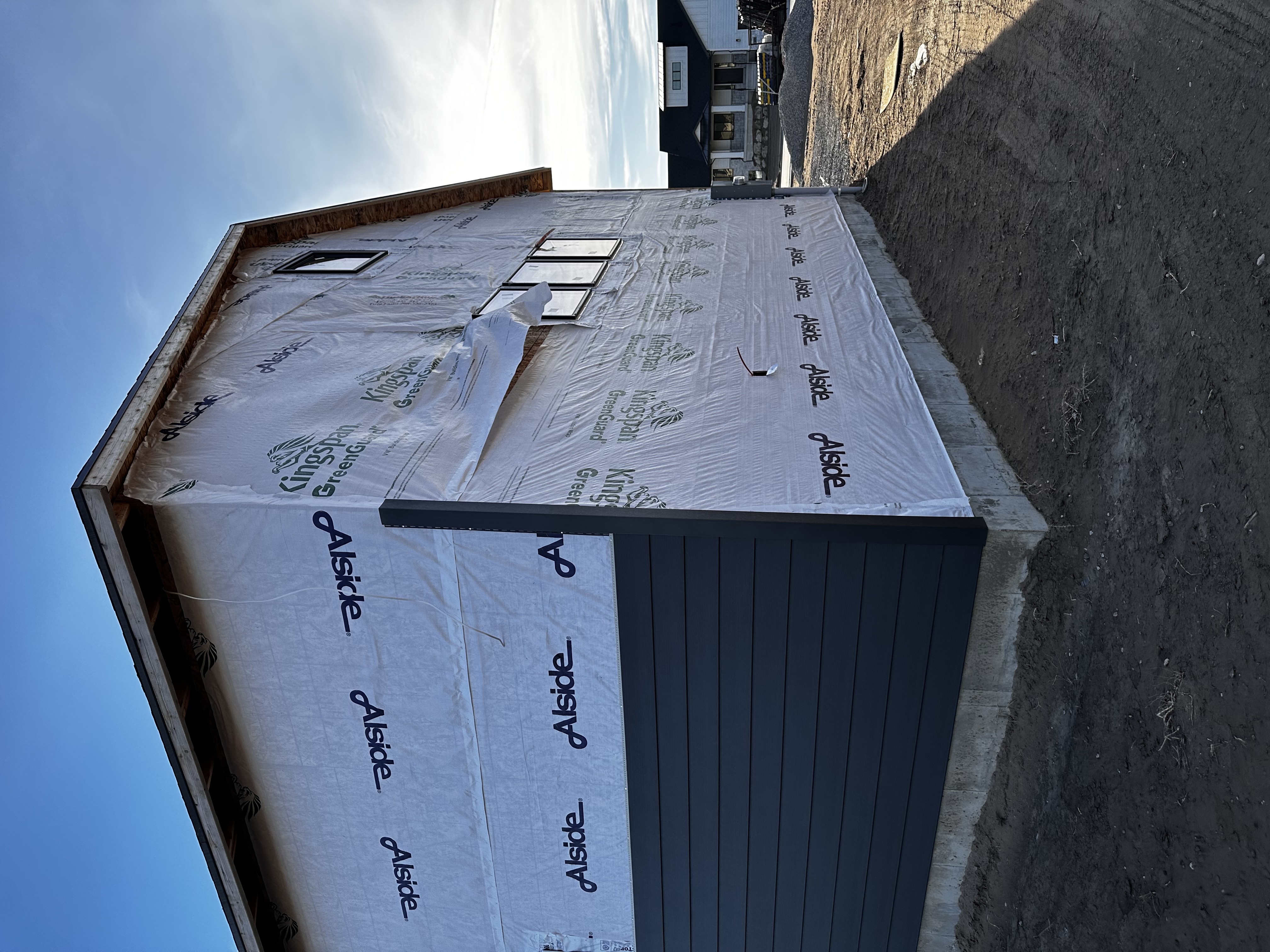 Different types of siding materials displayed on a house exterior