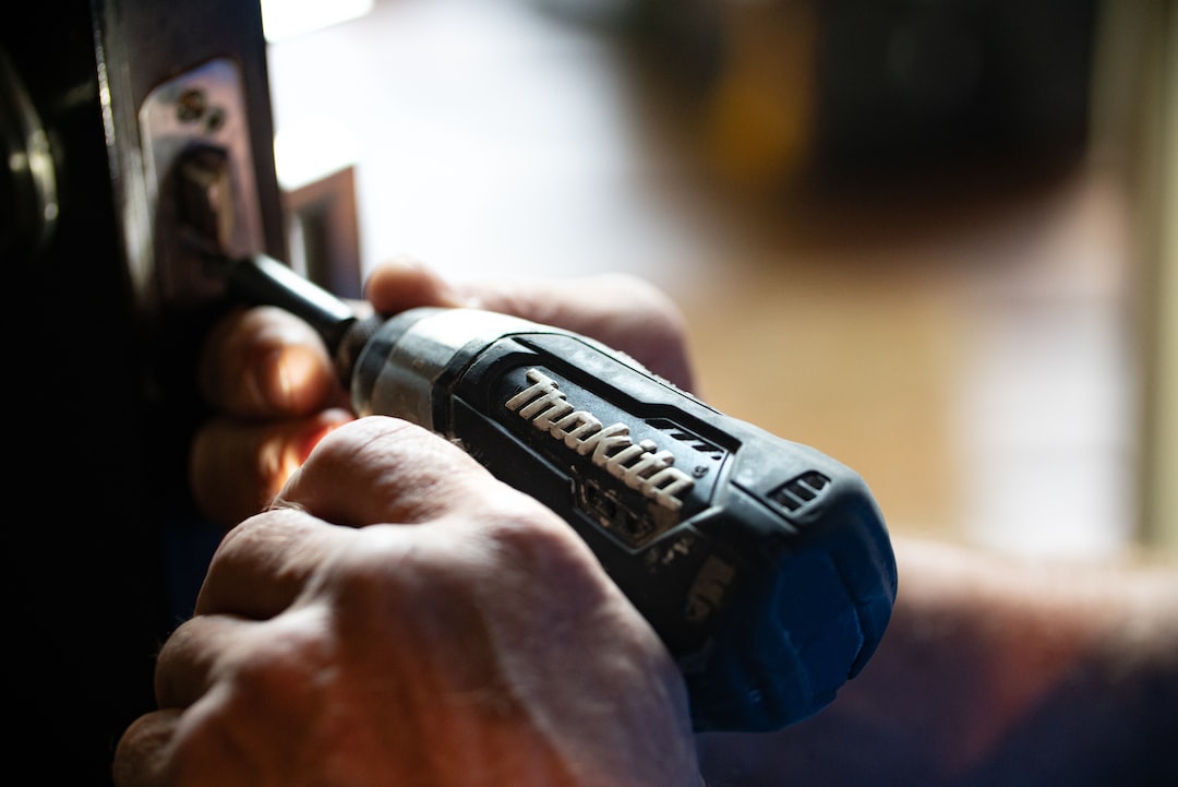 Handyman fixing door knob