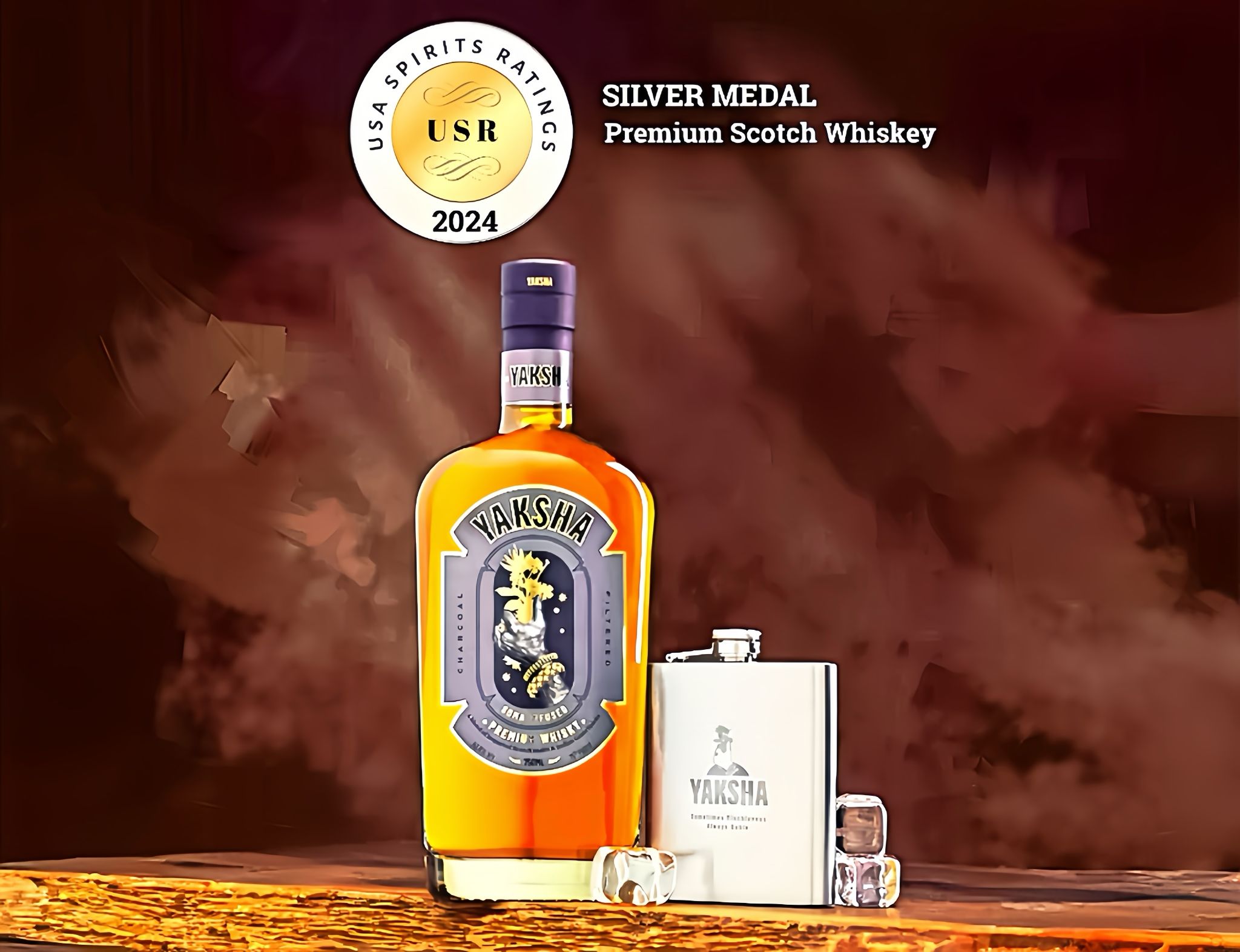 <p>Yaksha Whiskey, the Silver Medal Winner at the USA Spirits Ratings, is a premium spirit that blends the legendary ancient Indian folklore's Soma plant with the finest Scotch from the Scottish Highlands, creating a whiskey that transcends time and tradition. Yaksha Whiskey is meticulously crafted from supreme quality malt and expertly blended with Scotch, aged to perfection in first-fill Bourbon barrels made of American Oak. The result is a whiskey of unparalleled refinement, boasting a smooth texture and an exquisite smoky finish, achieved through a proprietary charcoal-filtering process. Drawing inspiration from the mischievous yet benevolent Yakshas, cosmic beings of Indian lore, this whiskey embodies the very spirit of Soma – a mystical elixir revered for its powers of immortality and abundance. </p>