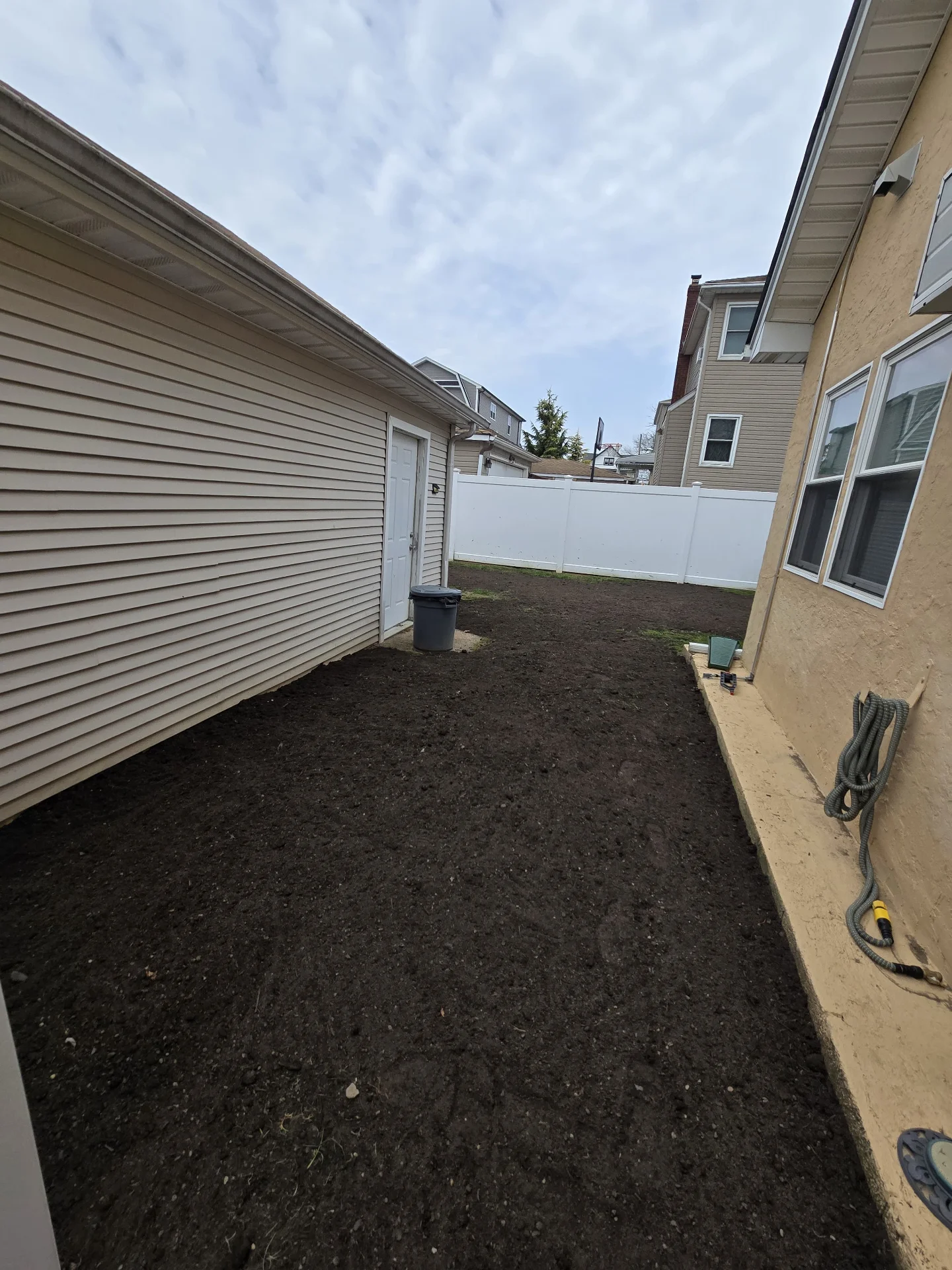Backyard leveled with top soil