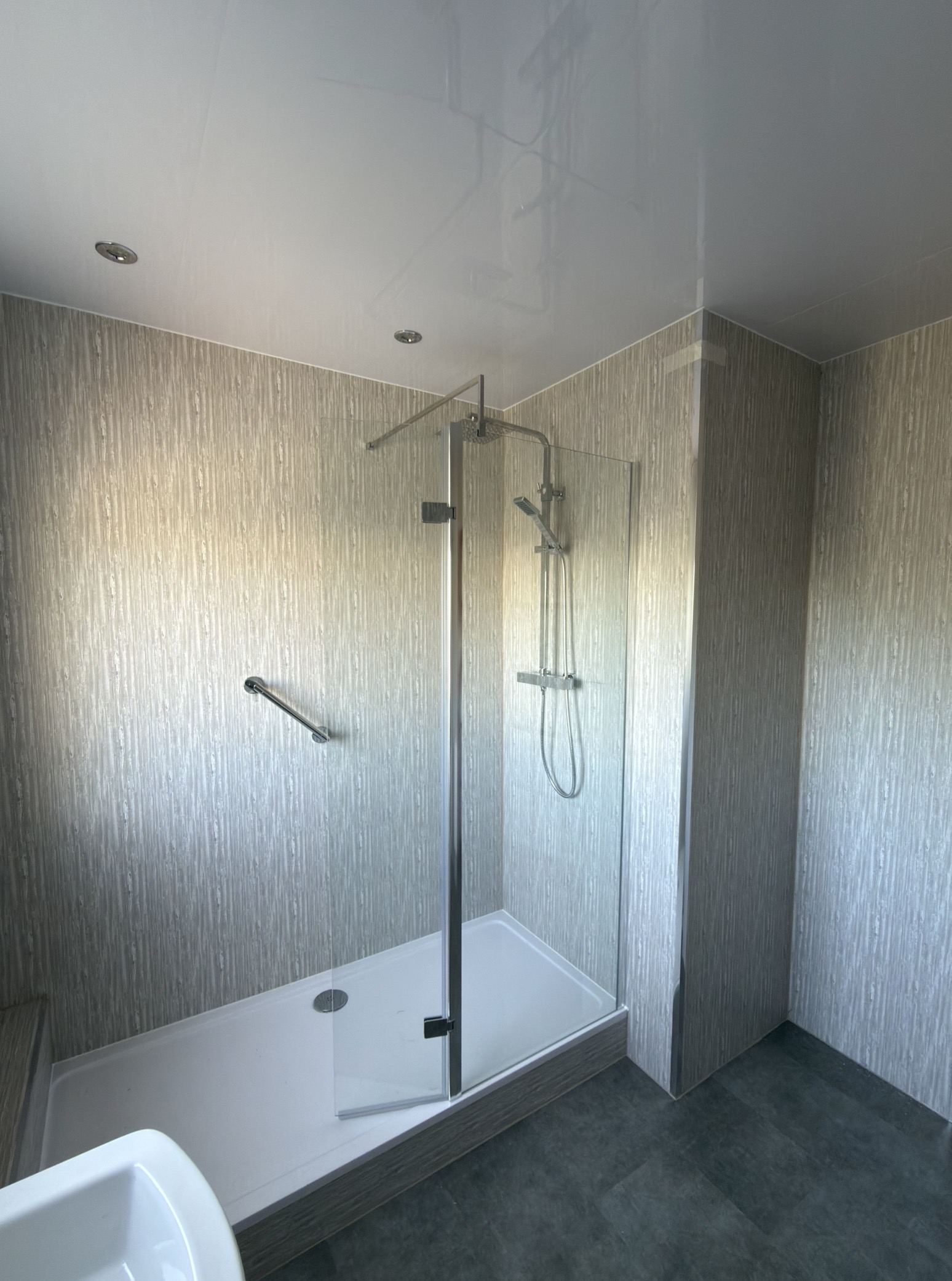 Close-up of the rainfall shower and glass enclosure