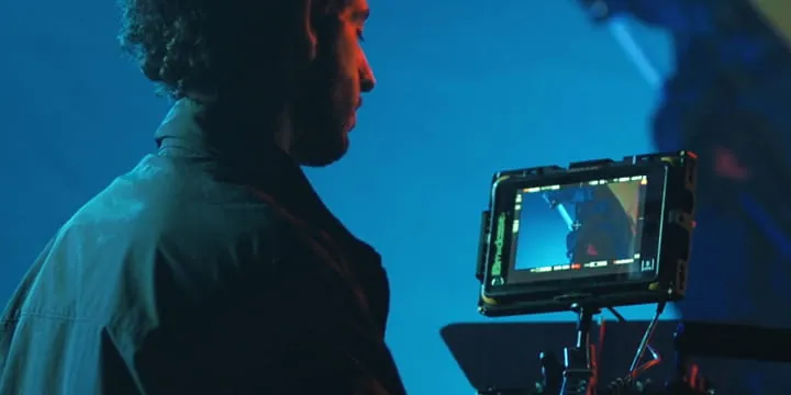 Filmmaker checking a field monitor
