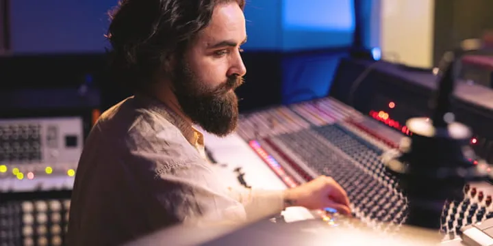 Sound engineer at a mixing console