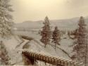 Wooden bridge in the Cascade mountain range during canal construction, Wenatchee Canal Company.