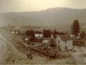 House by canal or stream in Cascade mountain valley, Wenatchee Canal Company.