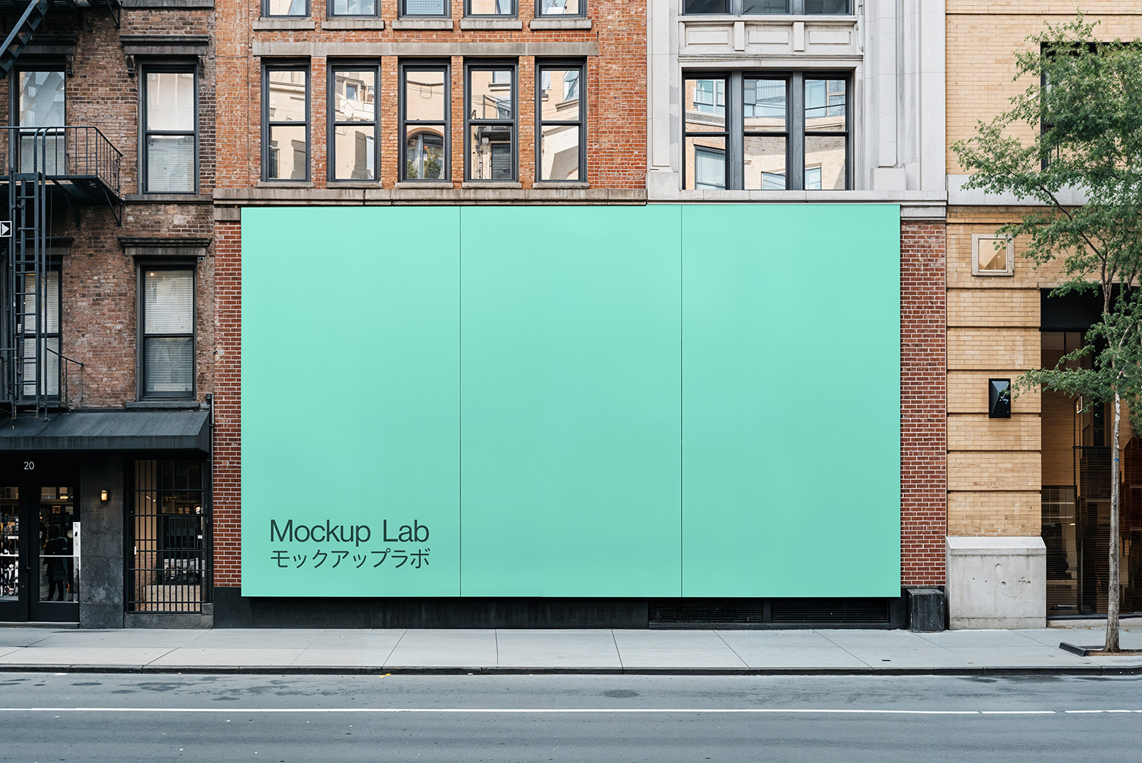 Front view of a large billboard mockup displaying a vibrant advertising design against a clear sky.