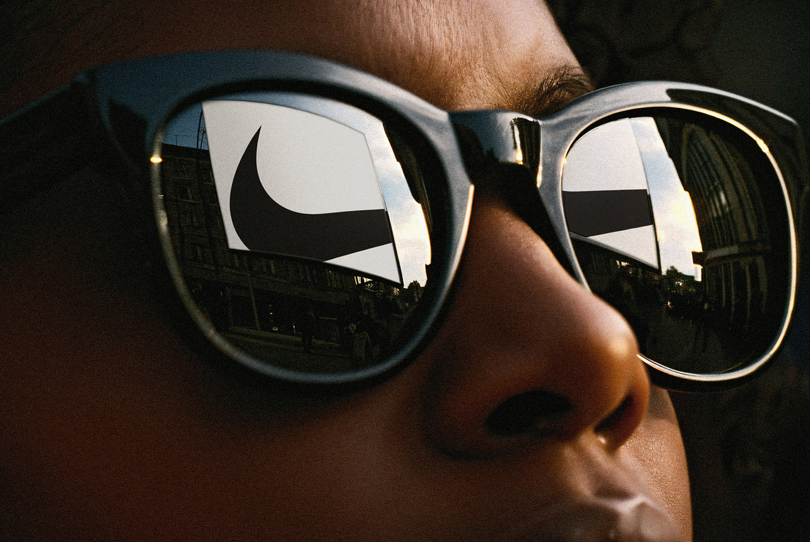 Front view of a large billboard design mockup with a subtle, realistic reflection.