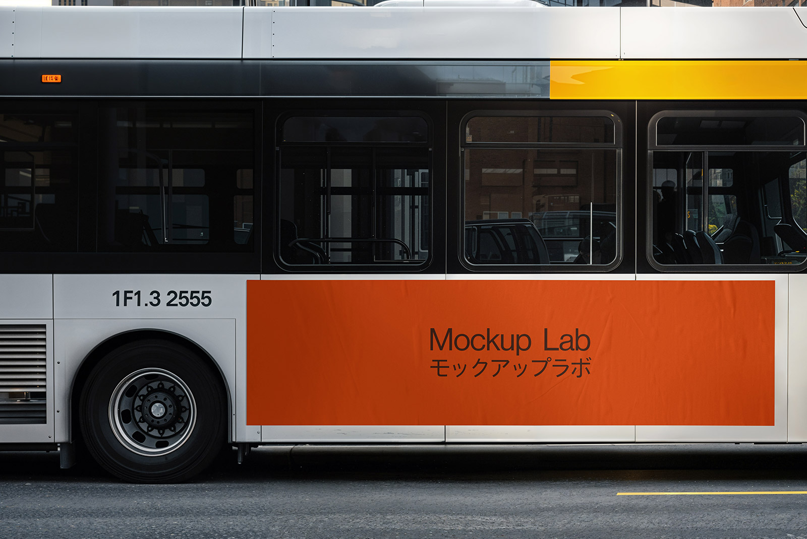 Front three-quarter view of the bus mockup parked on an urban street.