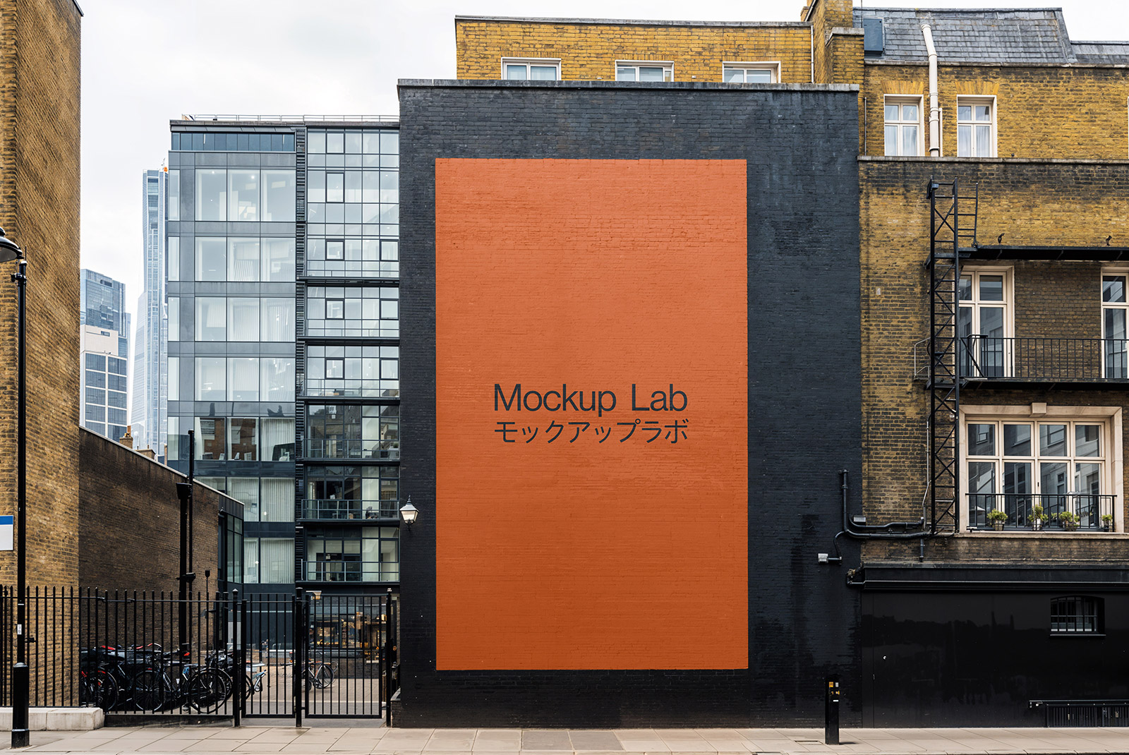 Front view of a large mural design displayed on an urban building wall.