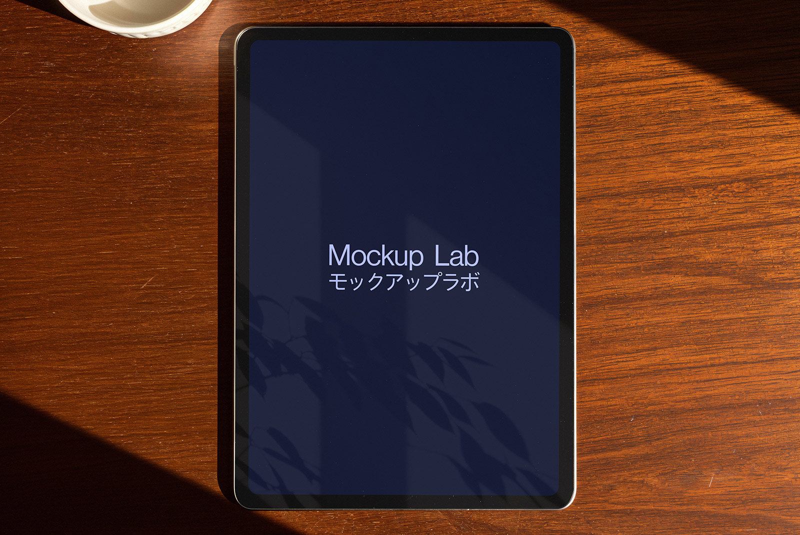 Front view of a tablet mockup displaying a design on its screen, set against a clean background.