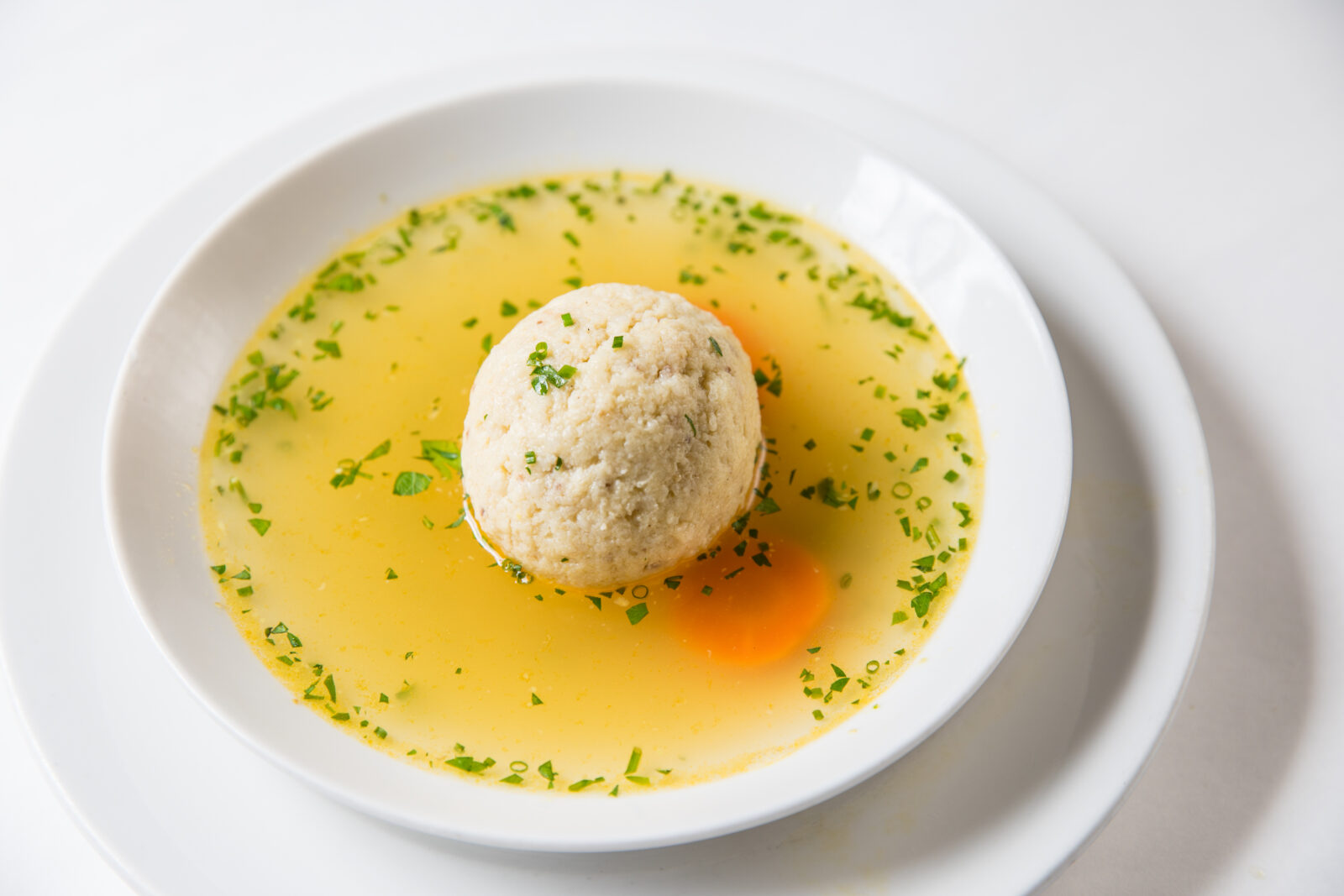 Mon Ami Gabi's Matzo Ball Soup available on the Passover menu