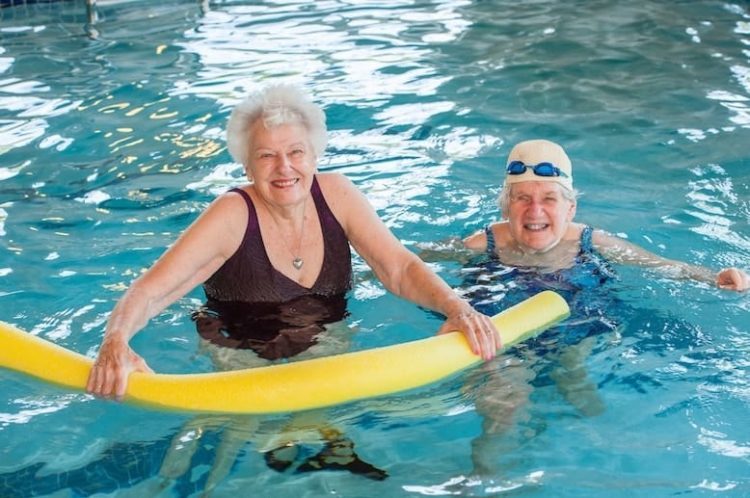 two senior women in pool
