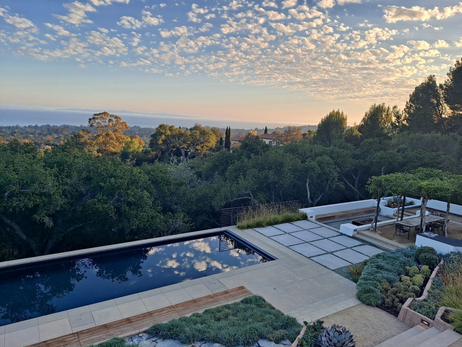 Luxury backyard with serene pool and ocean view