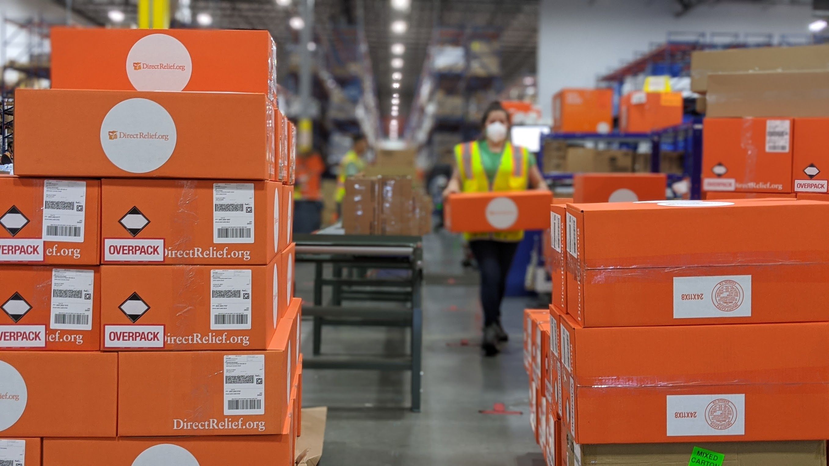 Orange boxes of medical relief await shipping from the warehouse at Direct Relief headquarters in Santa Barbara