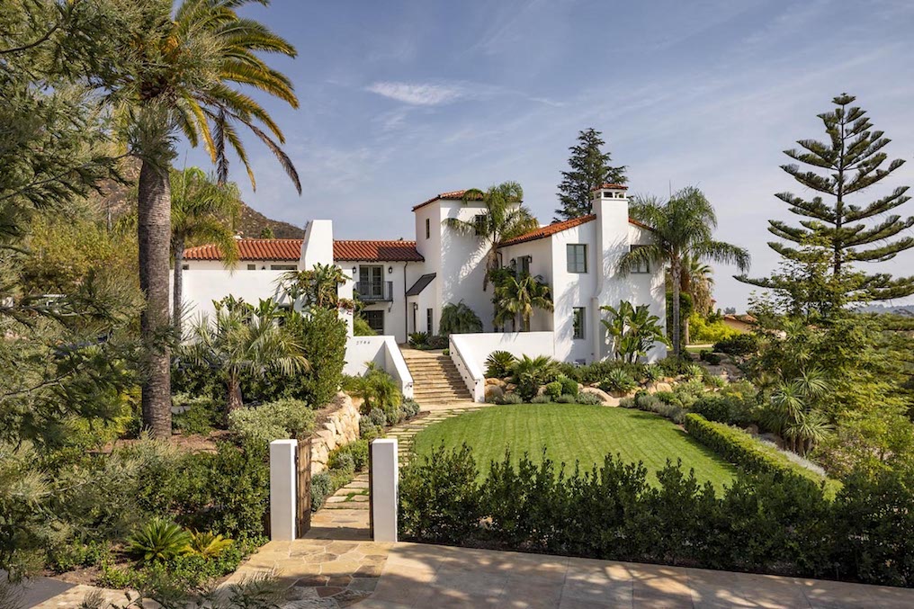 Front of Breathtaking Ocean View Montecito Retreat surrounded by blue sky. The home is currently for sale.