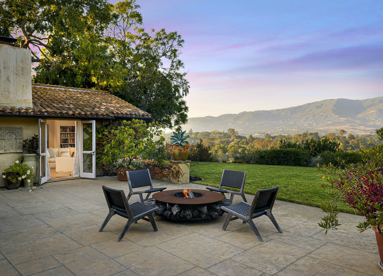 A welcoming backyard with an amazing view and colorful sky