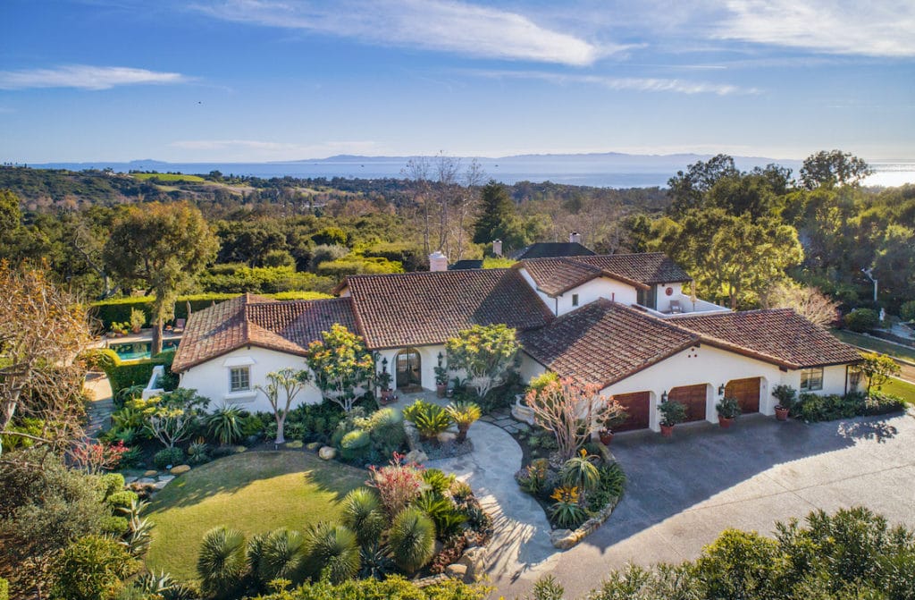 Aerial view of a sprawling Mediterranean-style home looking out to the ocean