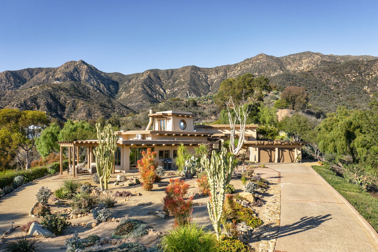 The front of a Distinctive Toro Canyon Home that's for sale complete with draught resistant plants making it a perfect vacation home