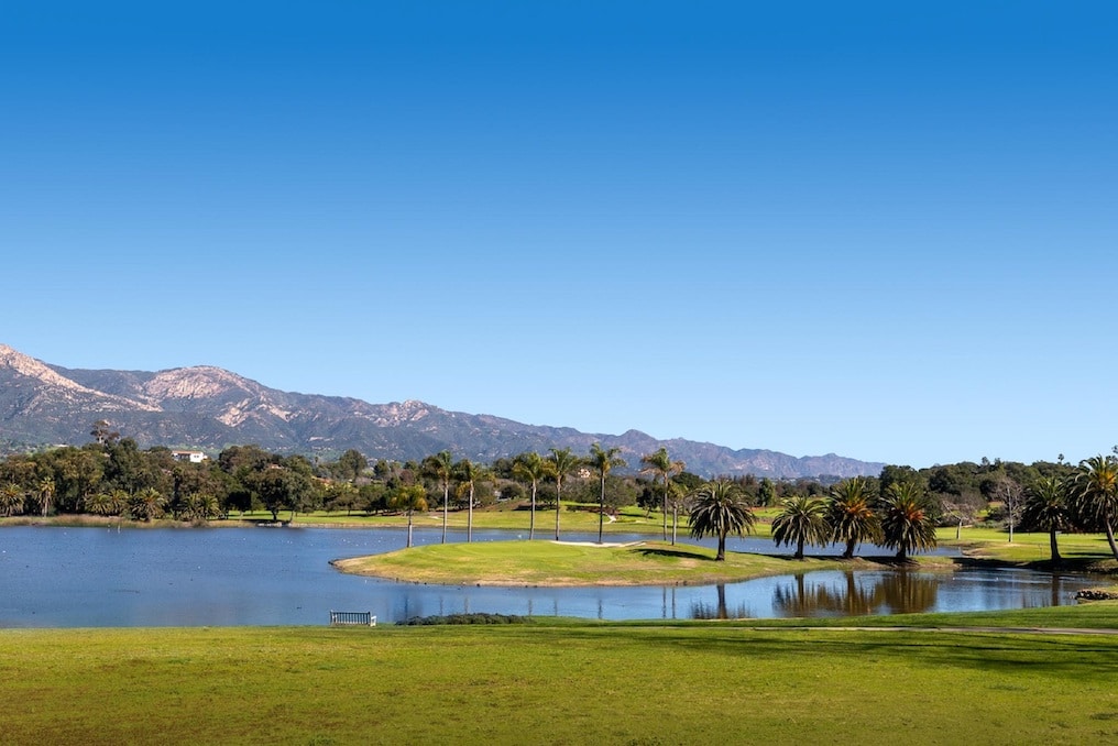 The lake in the center of the excluve Hope Ranch community with Palm trees and mountains