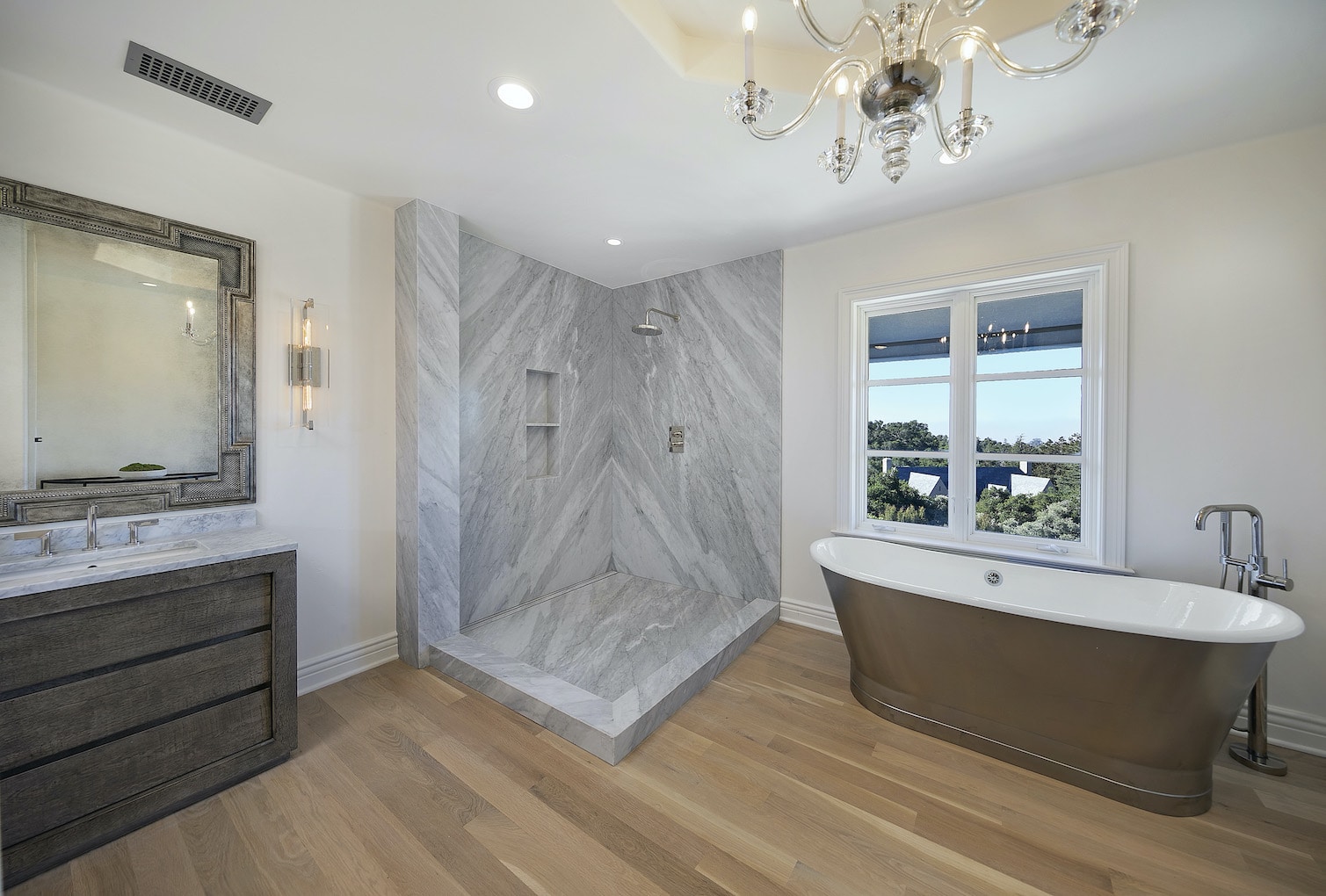 A luxury primary bath with shower and soaking tub