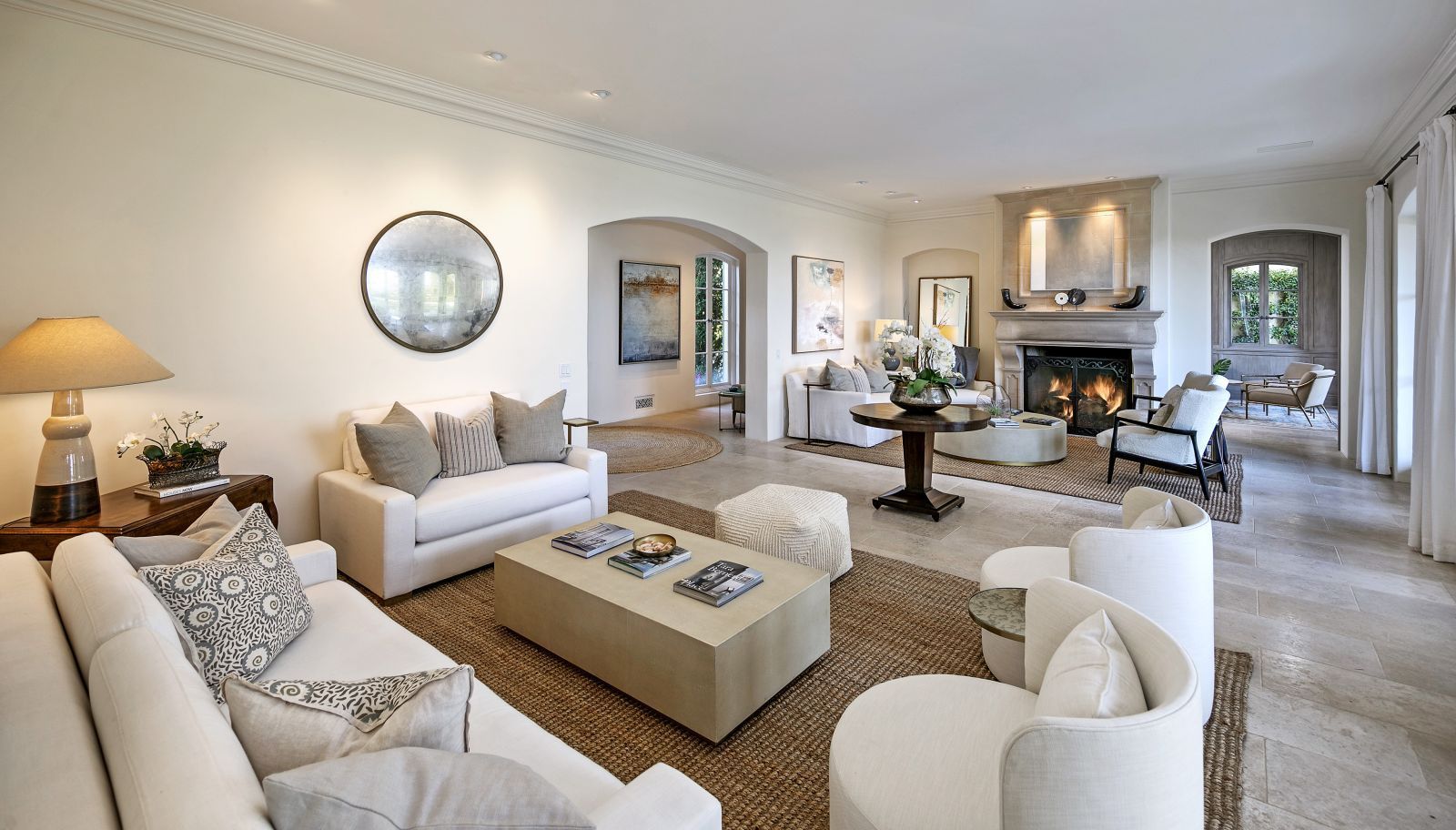 An uncluttered luxury living room in white.