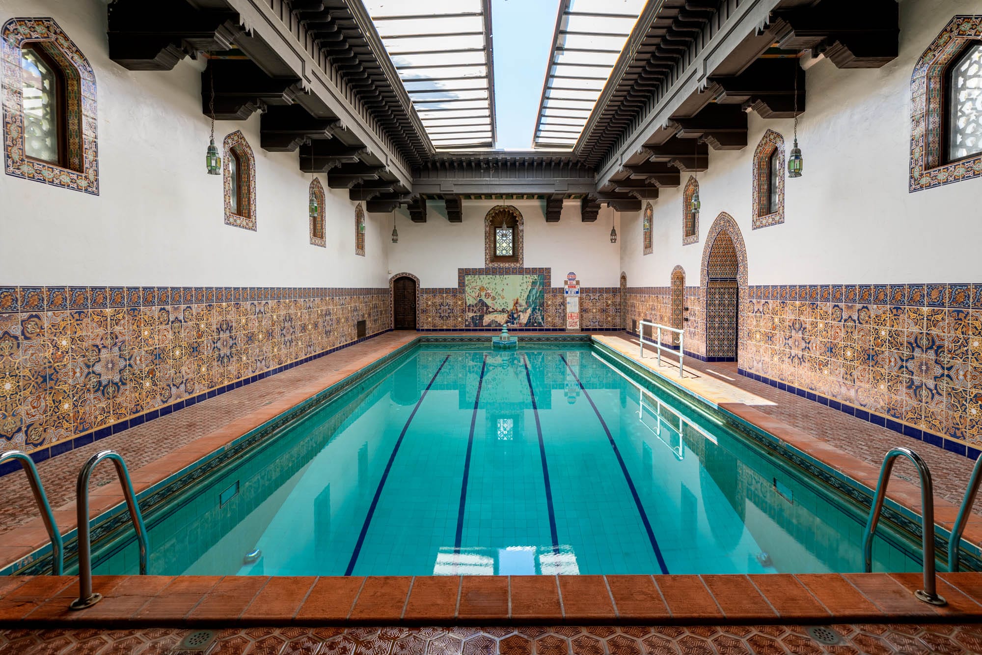 Indoor pool with huge skylight and hand painted tiles
