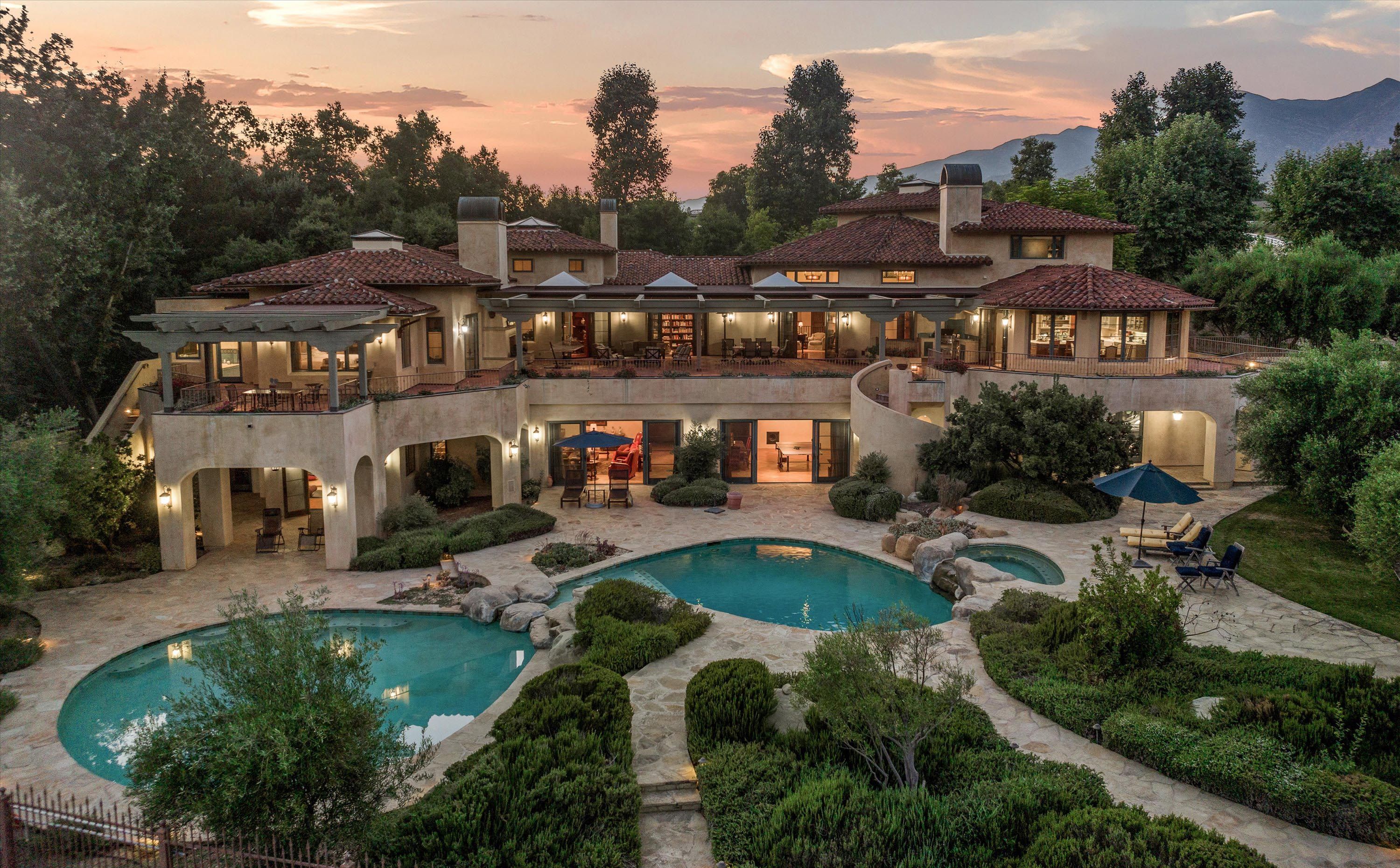 A birds eye view of a luxury home in Ojai at sunset