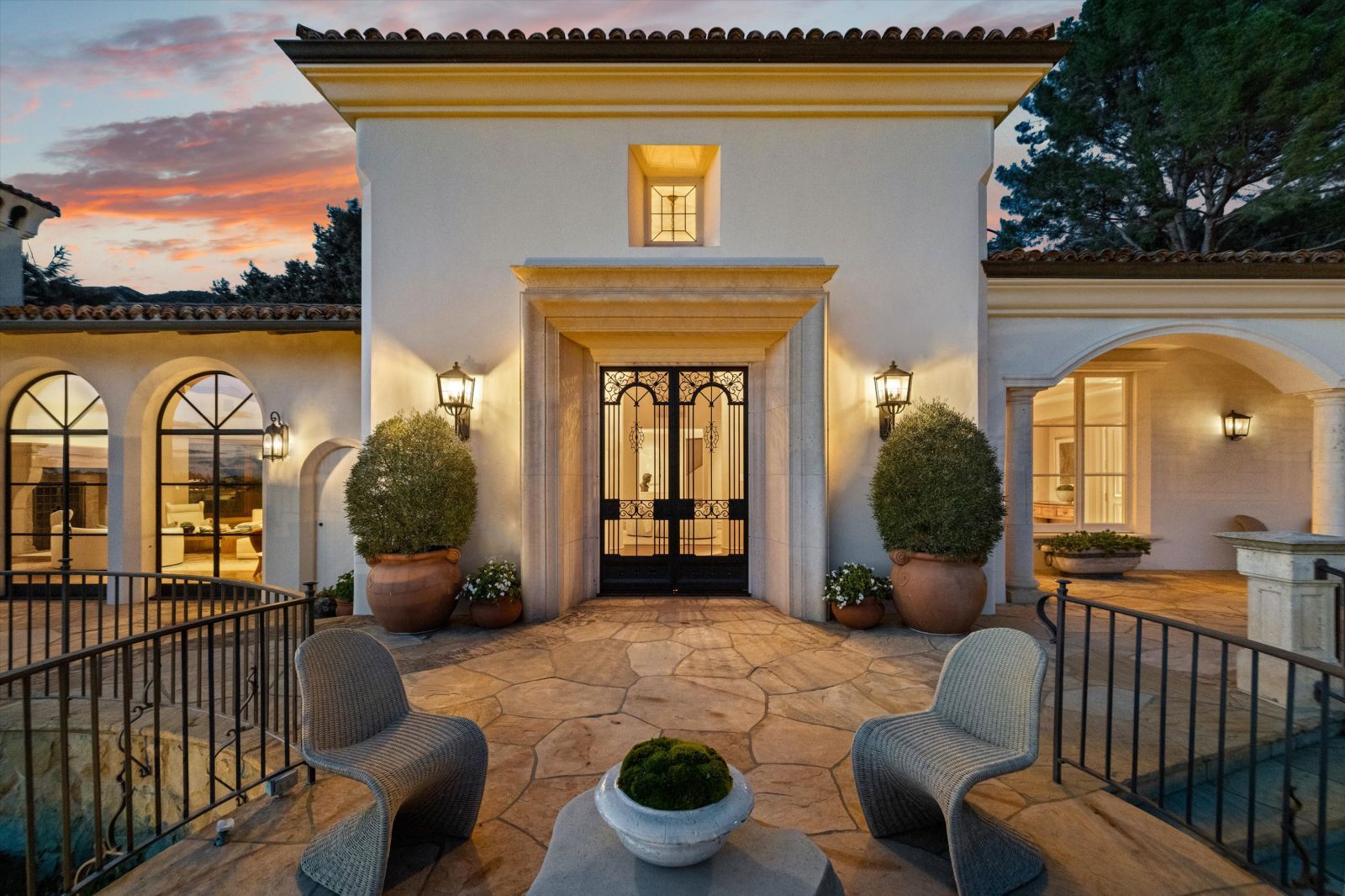 French doors leading to a patio of a Mediterranean estate reminiscent of a palazzo.