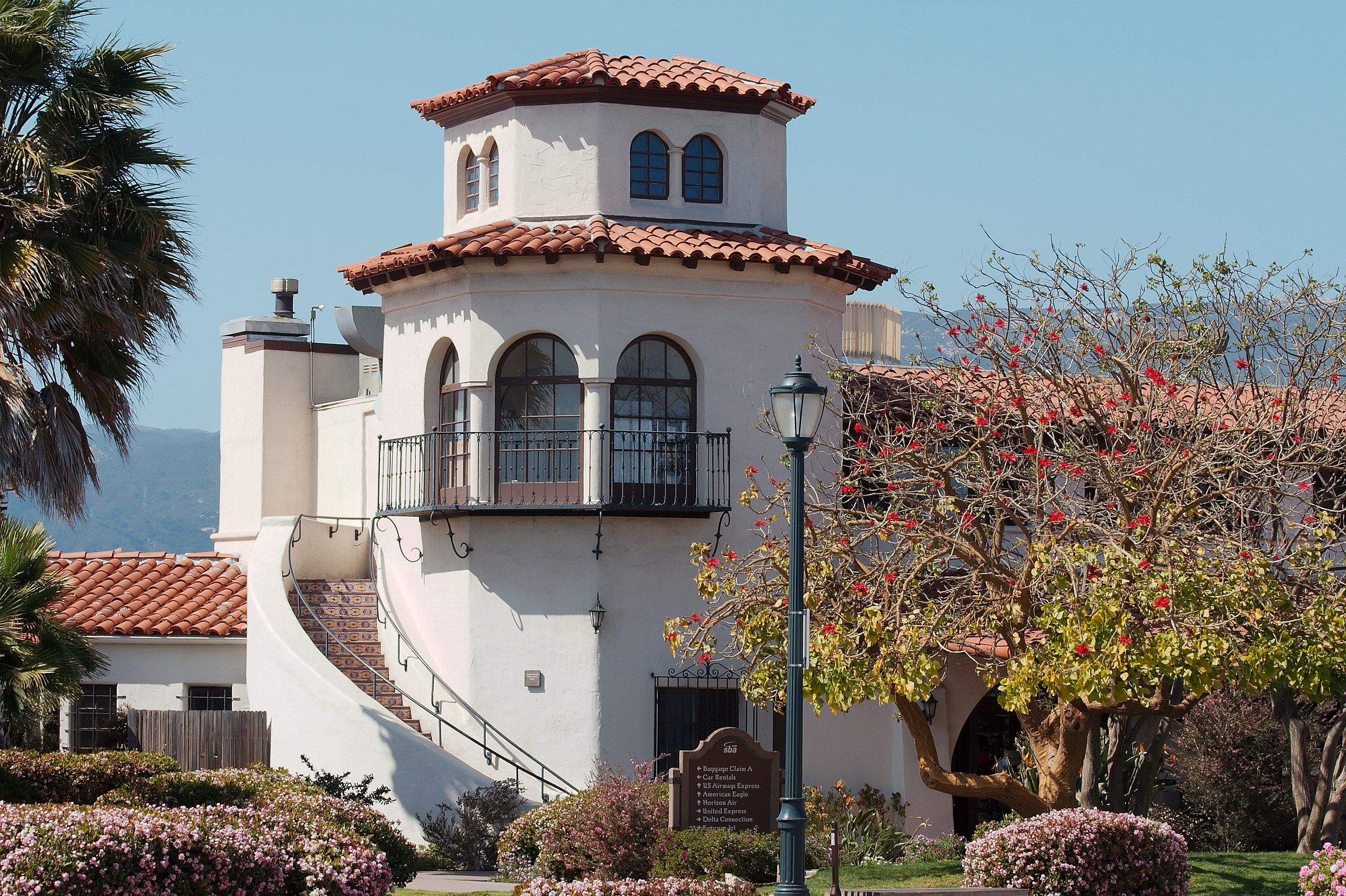 The Tower at the Santa Barbar Airport with its red tiled roof, gently curving staircase, and arched windows.