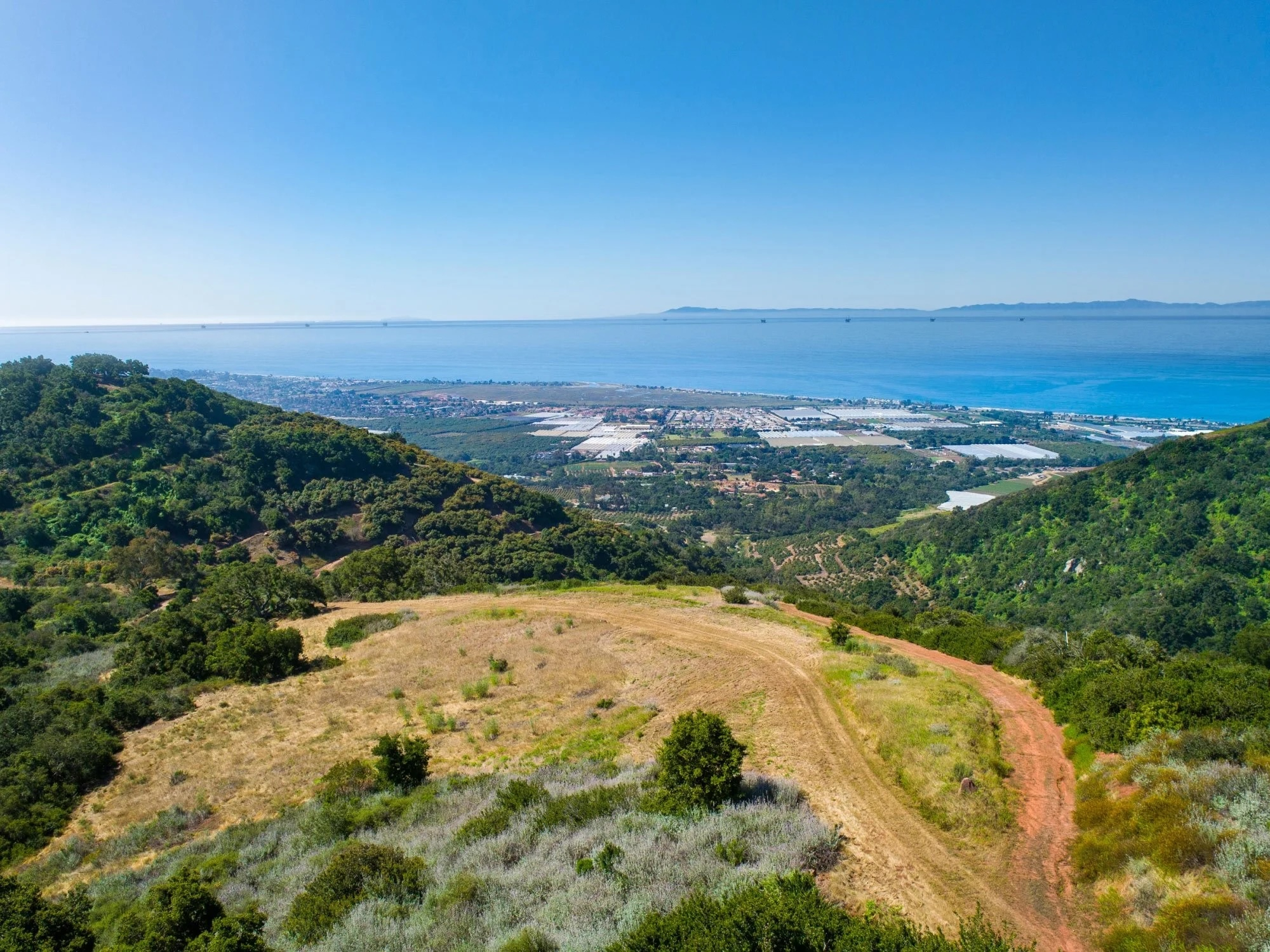 Carpinteria hillside property overlooking the coastal valley and Pacific Ocean, with the Channel Islands in the distance.