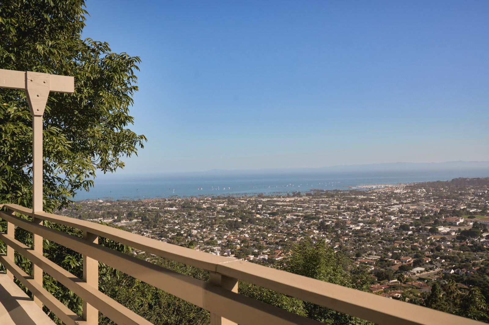 Panoramic ocean and Santa Barbara city view from a hillside balcony overlooking the coastline.