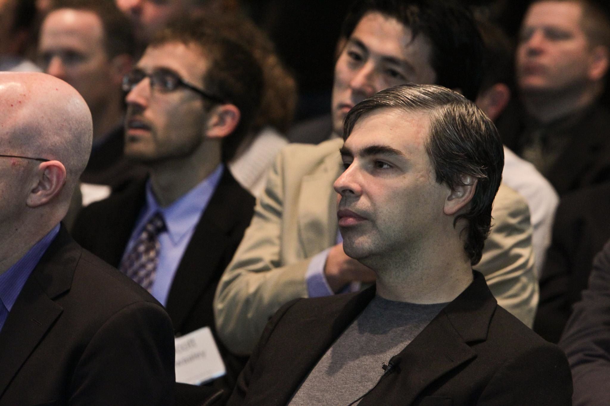 Larry Page, the co-founder of Google, sitting in an audience.
