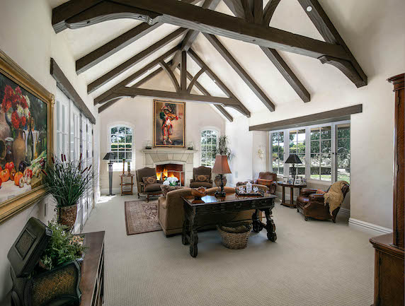 Before staging this luxury living room looks dark and cluttered.