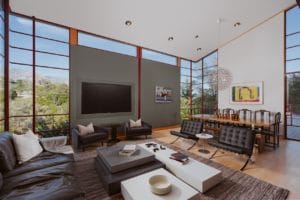 The living room of a Modernist house designed in Santa Barbara by architecut Rex lotery as his personal residence. The room features floor to ceiling windows with an amazing view.