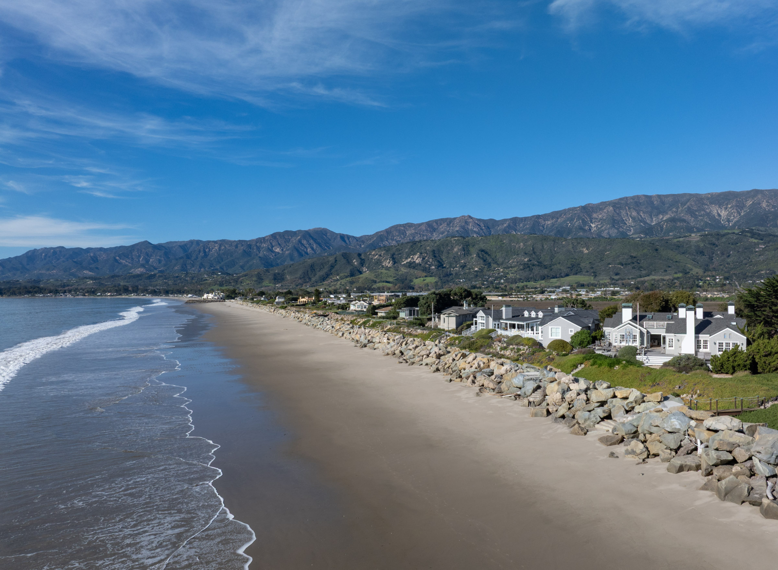 Montecito beachfront homes along the Santa Barbara coastline with ocean views and Santa Ynez Mountains in the background.