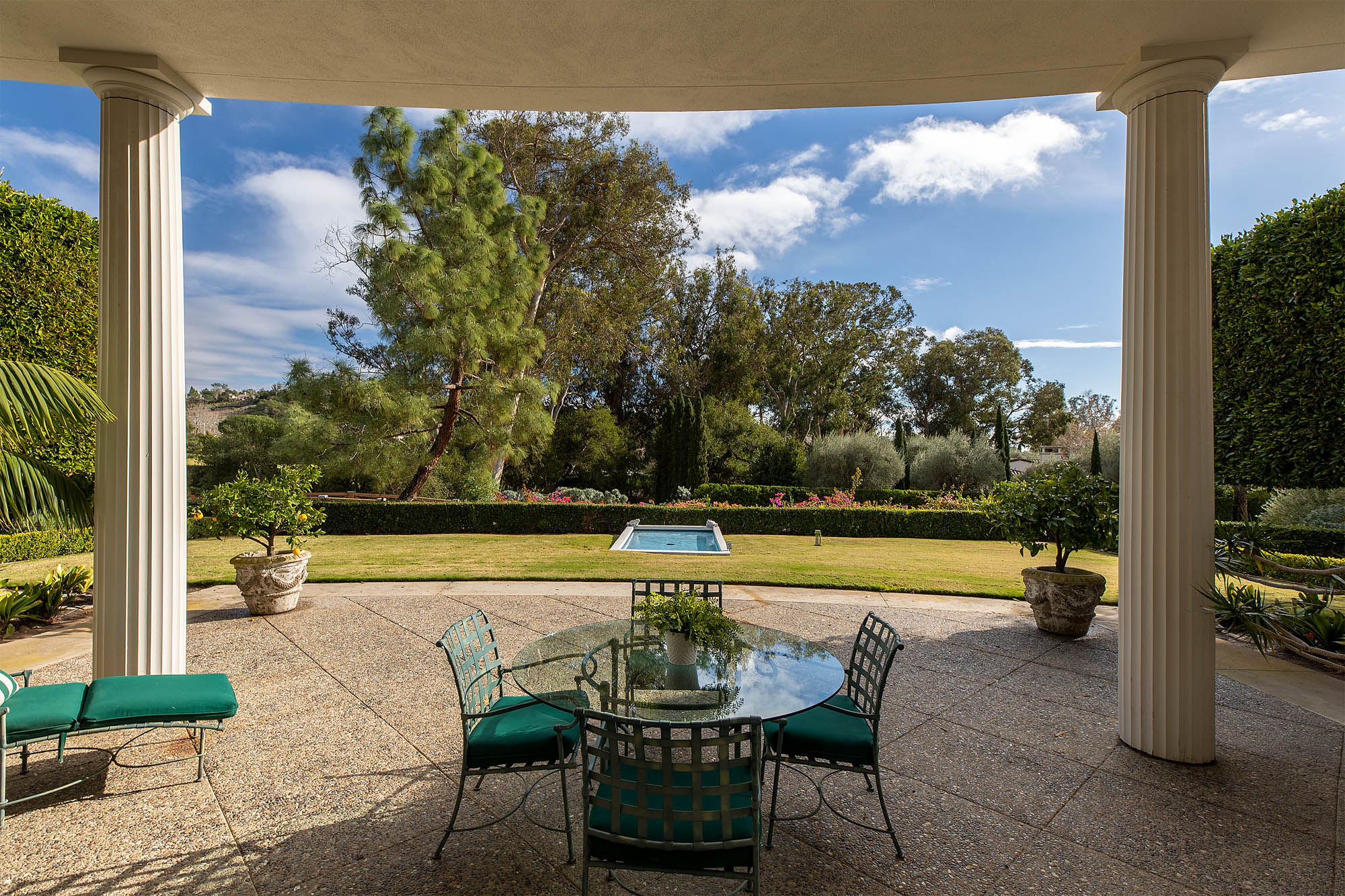 The stunning outside patio with pool beyond, perfect for Multigenerational gatherings.