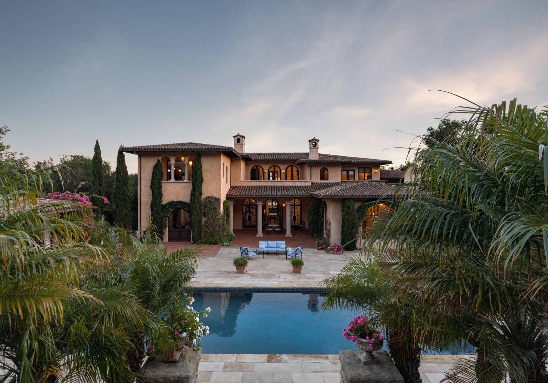 The backyard of a luxury home complete with swimmig pool inside a gated community