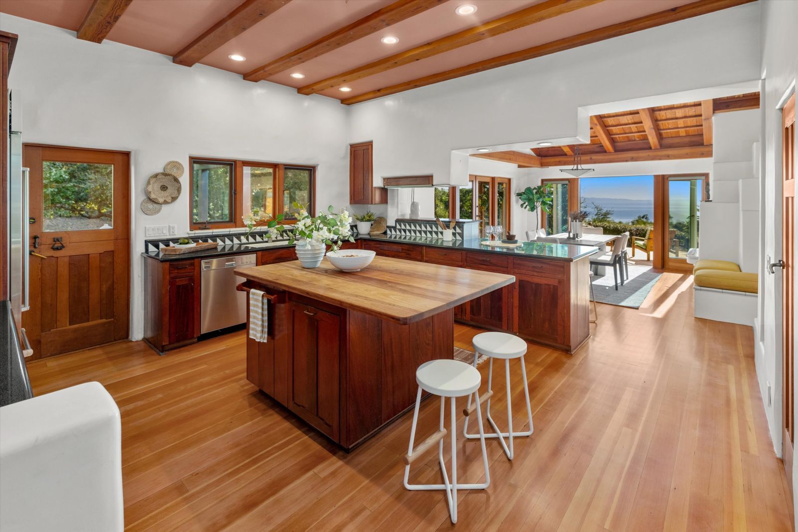 The kitchen in a luxury home with an amazing ocean view and lots of natural sunlight.