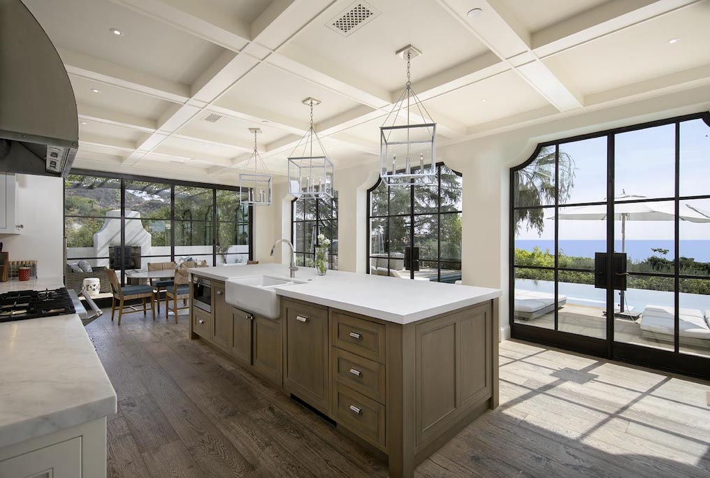 The kitchen in this MOntecito home is surrounded by clean windows with amazing views.