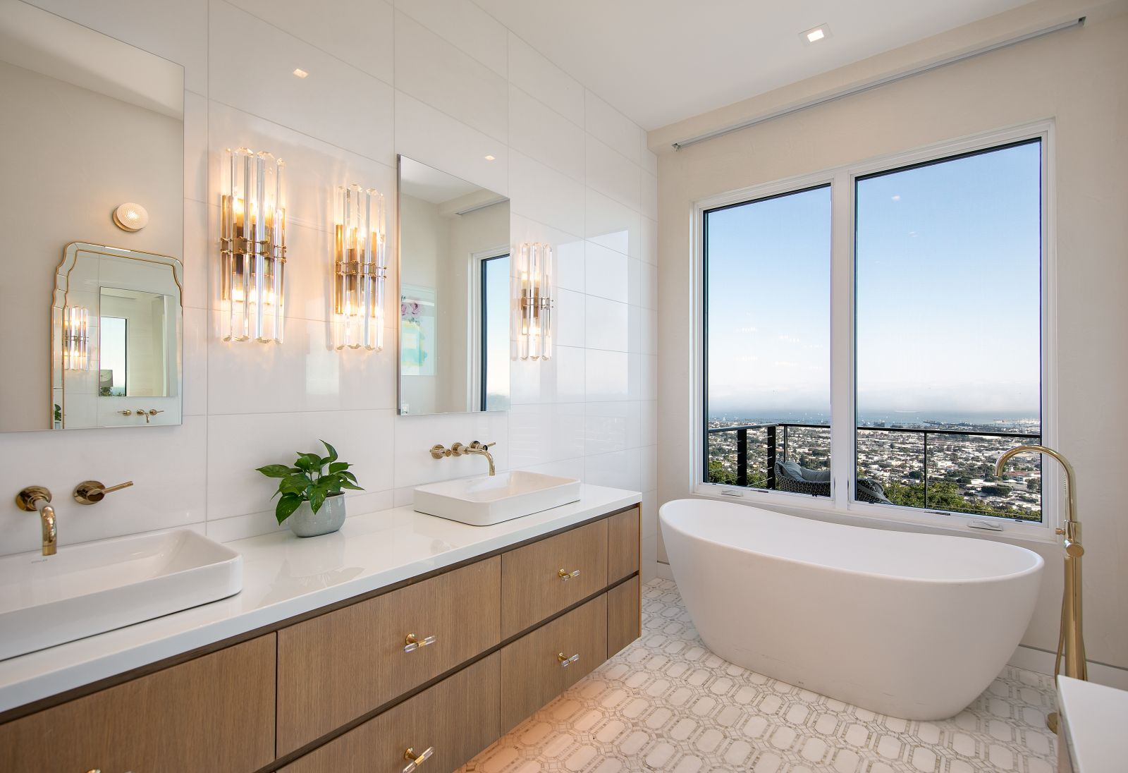 A moive in ready bathroom with a soaking tub with a view.