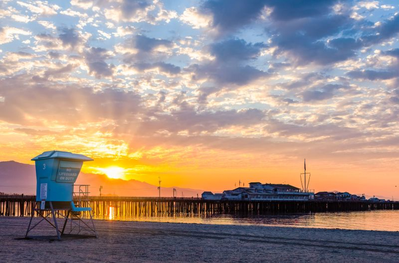 Santa Barbara's West Beach at sunrise, with Stearn's Wharf jutting out into the ocean