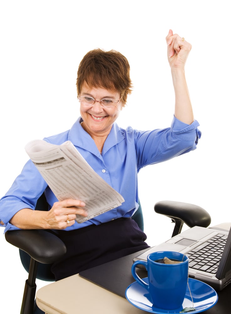 Businesswoman happy about the latest capital gains tax news.  Isolated on white.