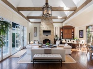 Living room in home for sale with high ceilings adding California chic