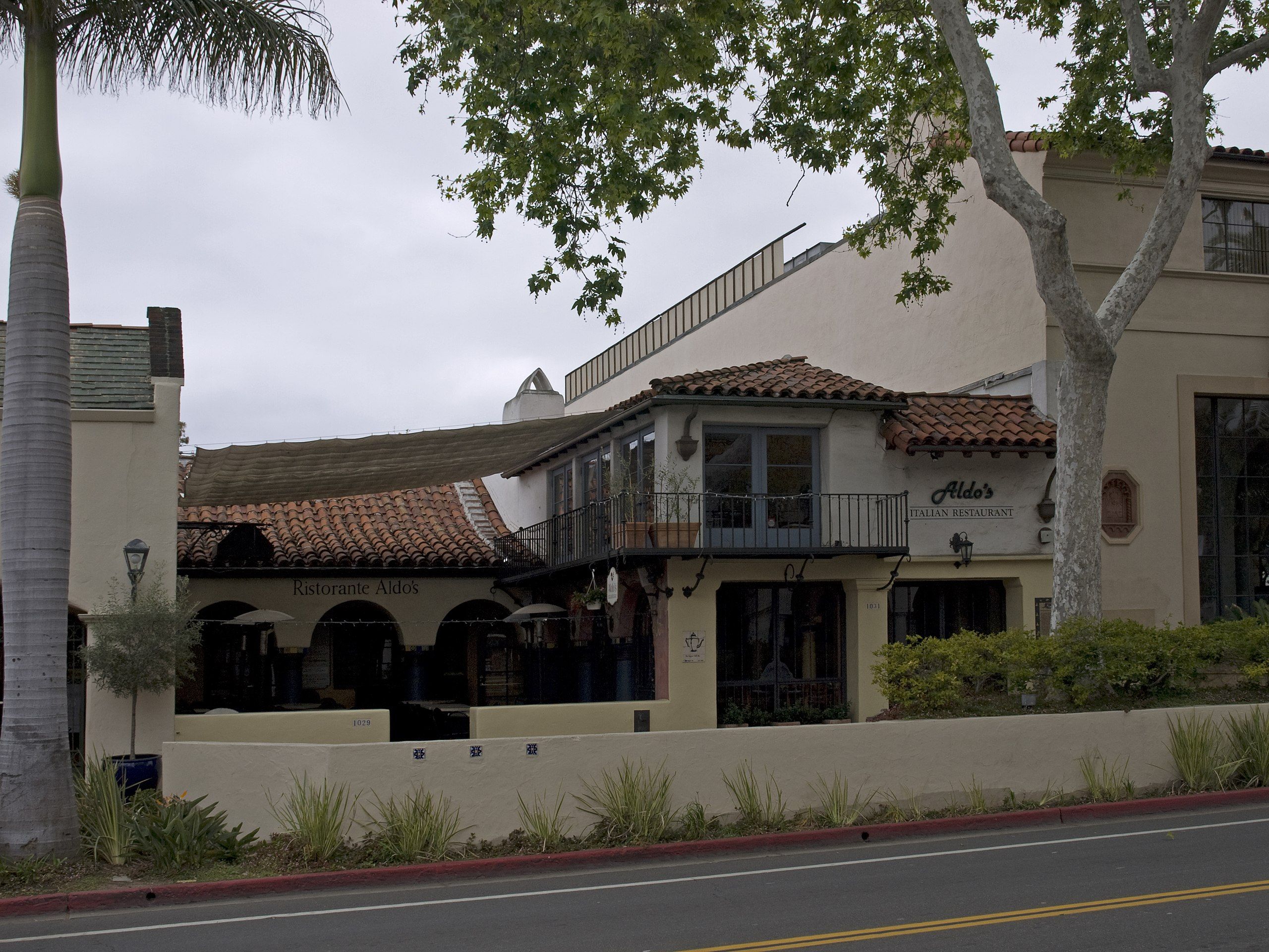 A street view of a historic Spanish Colonial style building in Santa Barbara.