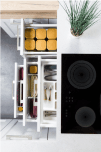 Image of totally organized kitchen drawers pulled out to show how diverders can really help keep it clean and organized.