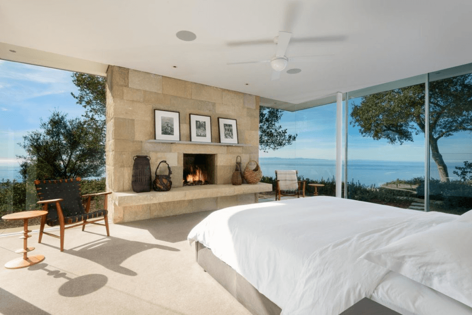 Master bedroom with lovely fire burning in fire place