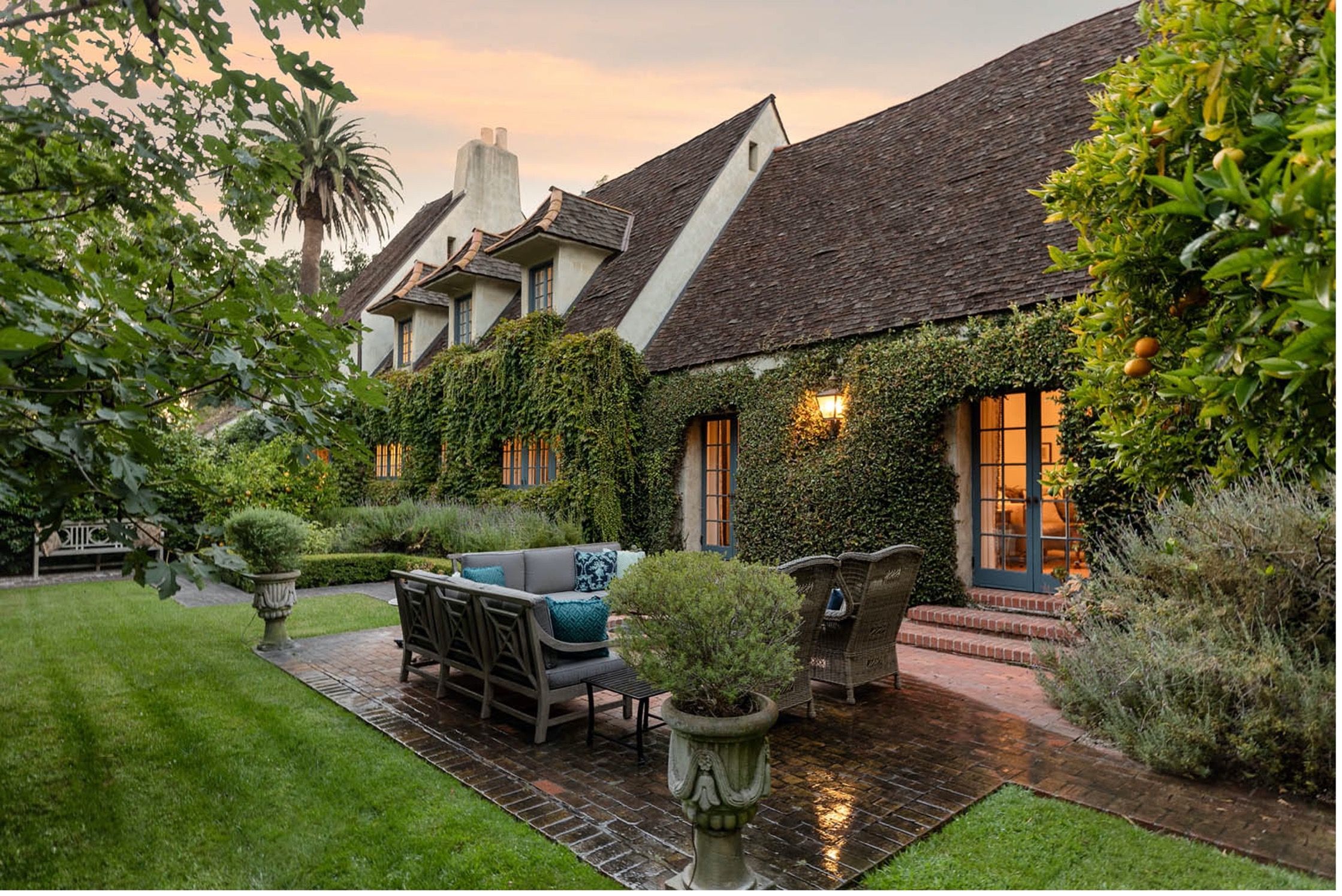 A substantial 2-story French Country-style residence with lush landscaping in Santa Barbara CA