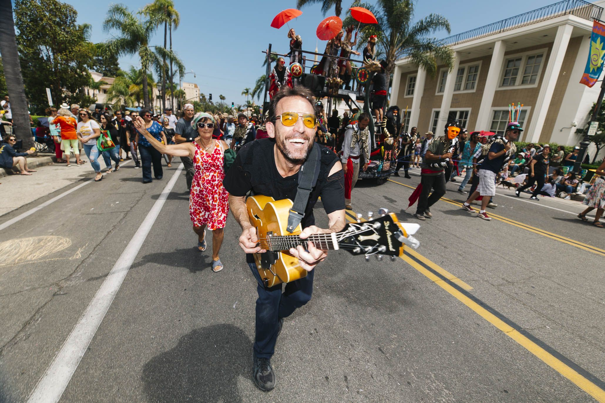 Kenny Loggins with his guitar leading the Summer Solstice parade on Santa Barbara's State Street.