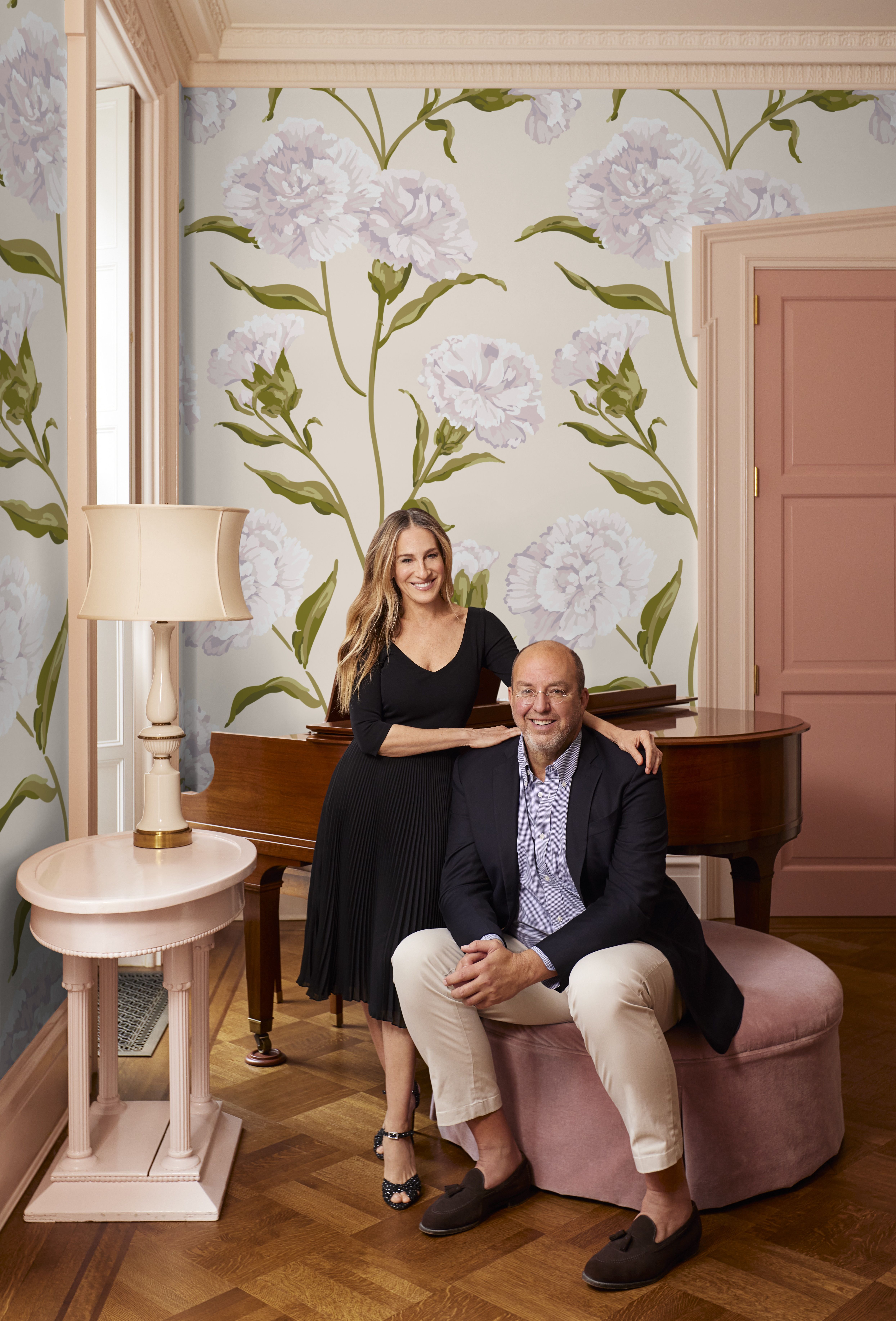 Sarah Jessica Parker and her partner Eric Hughes in front of the wallpaper they designed